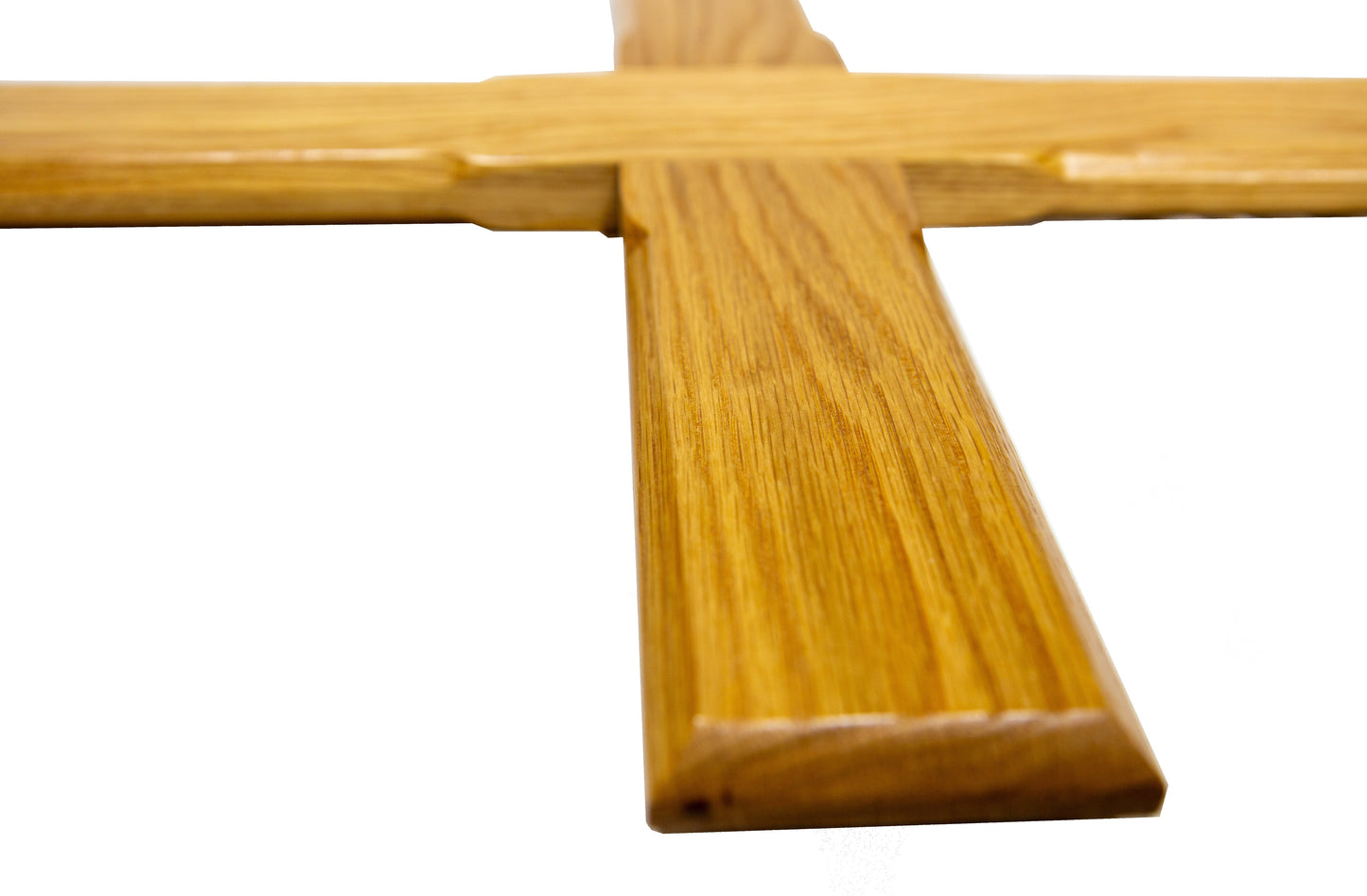 Close-up of a wooden cross on a white background